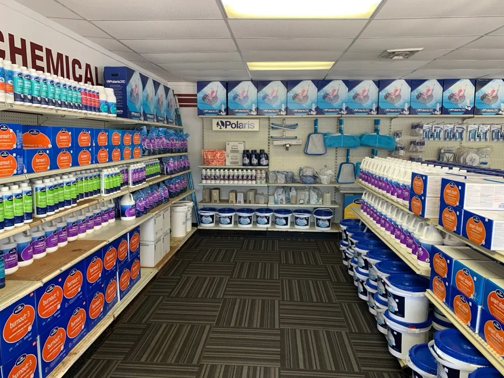 Aisles of Bioguard pool chemicals on the Aqua Jett retail floor