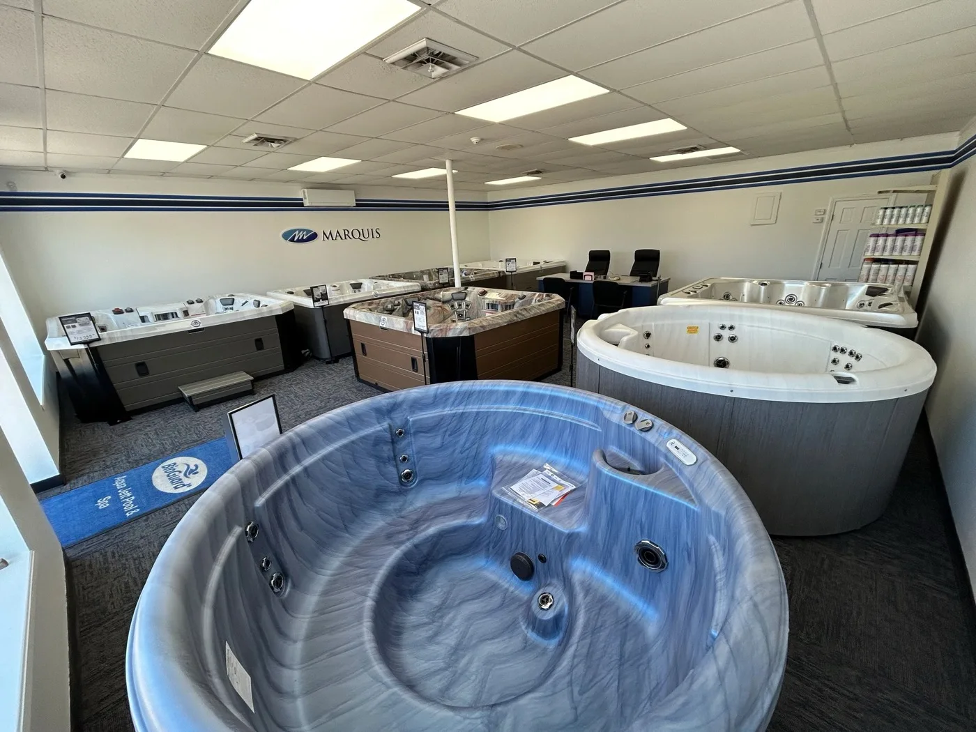 Hot tub showroom with Marquis and Nordic spas on display